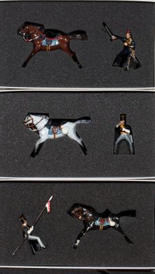 a display case with a collection of toy soldiers on it