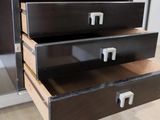 three drawers that are open on a wooden table