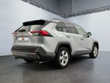 the rear end of a silver toyota rav parked in a garage