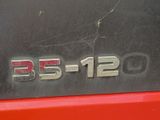 a close up of a red car with the number b5 - 12 on it