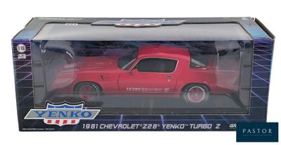 red toy car in a box on a white background