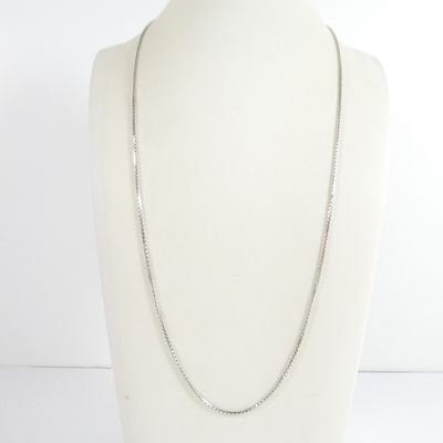 a close up of a mannequin torso with a chain on it