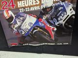 a poster of a motorcycle racer on display in a store