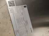 a piece of paper that is sitting on top of a refrigerator