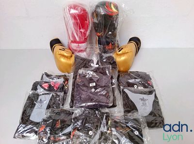 a pile of boxing gloves and other items on a table