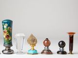 many different vases that are lined up on the table