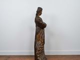 an image of a statue of a woman standing on a wooden floor