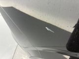 a close up of a car ' s door handle with a sticker on it