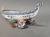 a white bowl with a design on it on a table