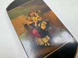 a skateboard with a picture of a woman and a dog on it