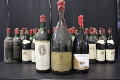 many bottles of wine sitting on a black table