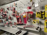 many different tools on the wall in the store