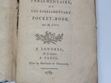 an old book opened to a page with a picture of a bird on top of it