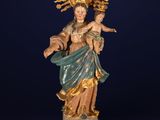 a statue of the virgin mary holding a child in her arms