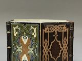 an old book with a decorative design on the cover