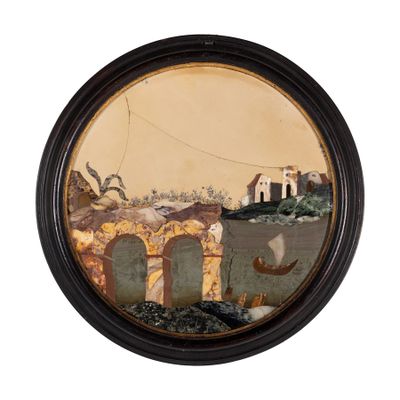 une photo d'un tableau dans un cadre noir accroché au mur