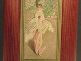 painting of a woman in a white dress holding a fan in a wooden frame