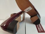 pair of women ' s shoes on a box with a white background