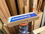 a box that is sitting on top of a pile of wood