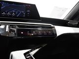 the interior of a car with a car radio and a steering wheel