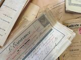 a pile of old papers sitting on top of a table