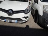 two cars parked next to each other in a parking lot