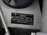 a close up of a machine that has a caution sign on it