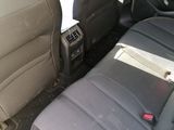 the back seats of a car are empty and the seats are empty