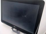 a tablet computer sitting on top of a white table