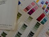 a close up of a bunch of color samples on a table
