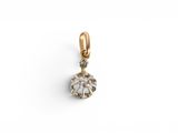 an image of a gold and diamond pendant on a white background