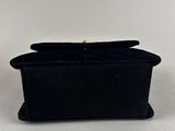 a black velvet box with a gold clasp on top