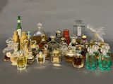 a lot of different bottles of perfume on the table