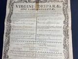 an old document with writing on it sitting on top of a table