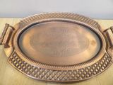 a metal tray that has a design on it