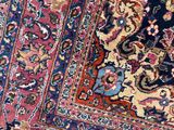 a close up of a rug on a wooden floor