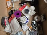a box full of assorted items sitting on a table