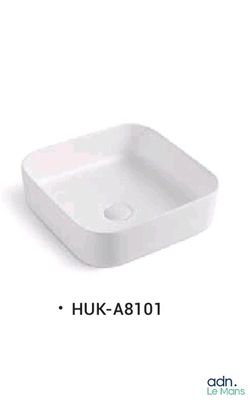 a close up of a white square sink on a white background