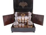 a wooden box with a set of glassware in it