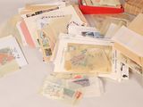 a pile of stamps and envelopes sitting on a table
