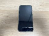 an image of a cell phone sitting on top of a wooden table