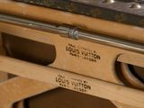 an old fashioned sewing machine sitting on top of a wooden table