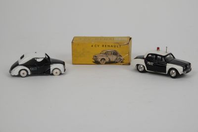 three toy cars are sitting in front of a box on a white surface