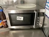 a microwave that is sitting on a counter in a kitchen