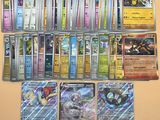 beaucoup de cartes pokemon différentes sur la table