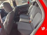 a red car that is sitting in the back of the car
