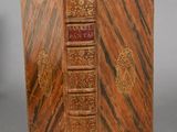 an old book that is sitting on a table