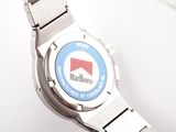 a close up of a wrist watch with a logo on it