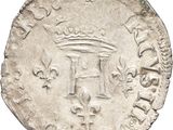 an old silver coin with a crown on top of it
