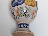 a small vase with a blue and white design on it